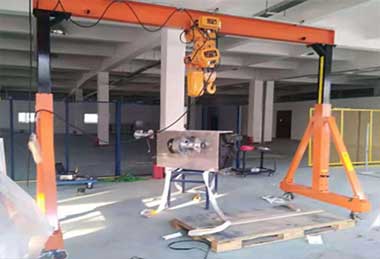 A frame crane with electric chain hoist