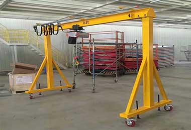 A frame crane with electric wire rope hoist