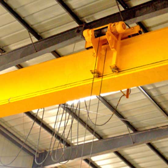 Low headroom overhead travelling crane with partial hang hoist trolley 