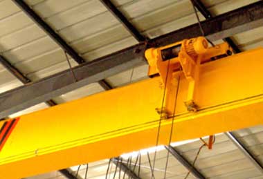 Low headroom overhead travelling crane with electric wire rope hoists