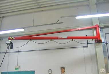 Wall mounted jib crane with vacuum lifter for glass handling