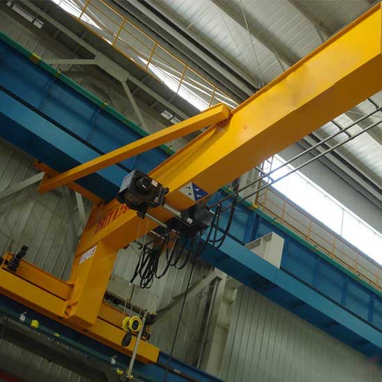 Wall travelling jib cranes