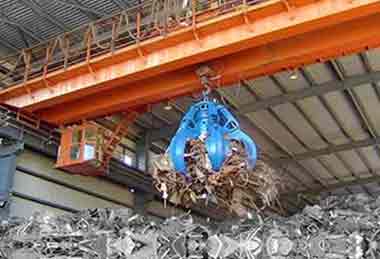 Steel scrap handling orange peel grab overhead crane
