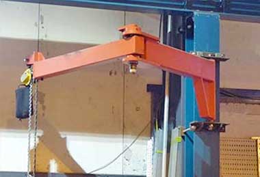 Wall mounted jib crane with articulating cantilever design