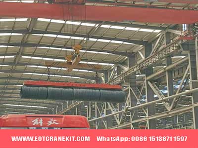 Overhead magnetic beam for wire rod loading and unloading of trucks