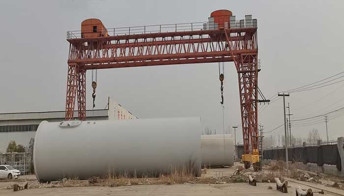 Gantry Cranes on Tracks Elevating Wind Turbine Construction