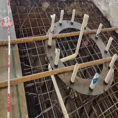 Put the embeded foundation cage into the hole 