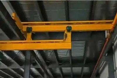 Telescoping overhead cranes for limited space workshops