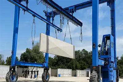 Industrial straddle carrier for concrete component handling 